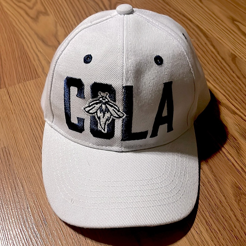 Cola Columbia Fireflies white hat with blue lettering.